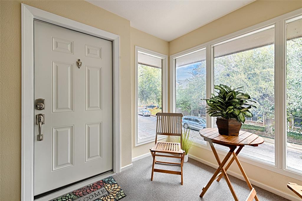 10757 Villager Road, Unit D Dallas, TX 75230 - Photo 5 of 21 a living room with furniture and a potted plant