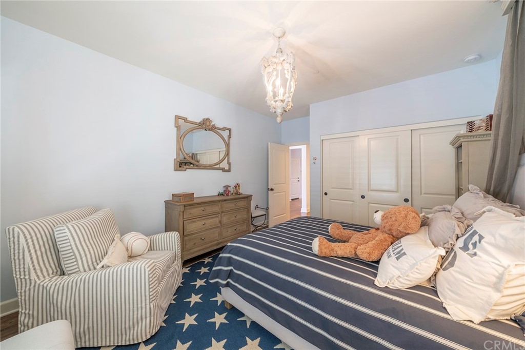 71 Como Irvine, CA 92618 - Photo 32 of 45 a bedroom with furniture and wooden floor