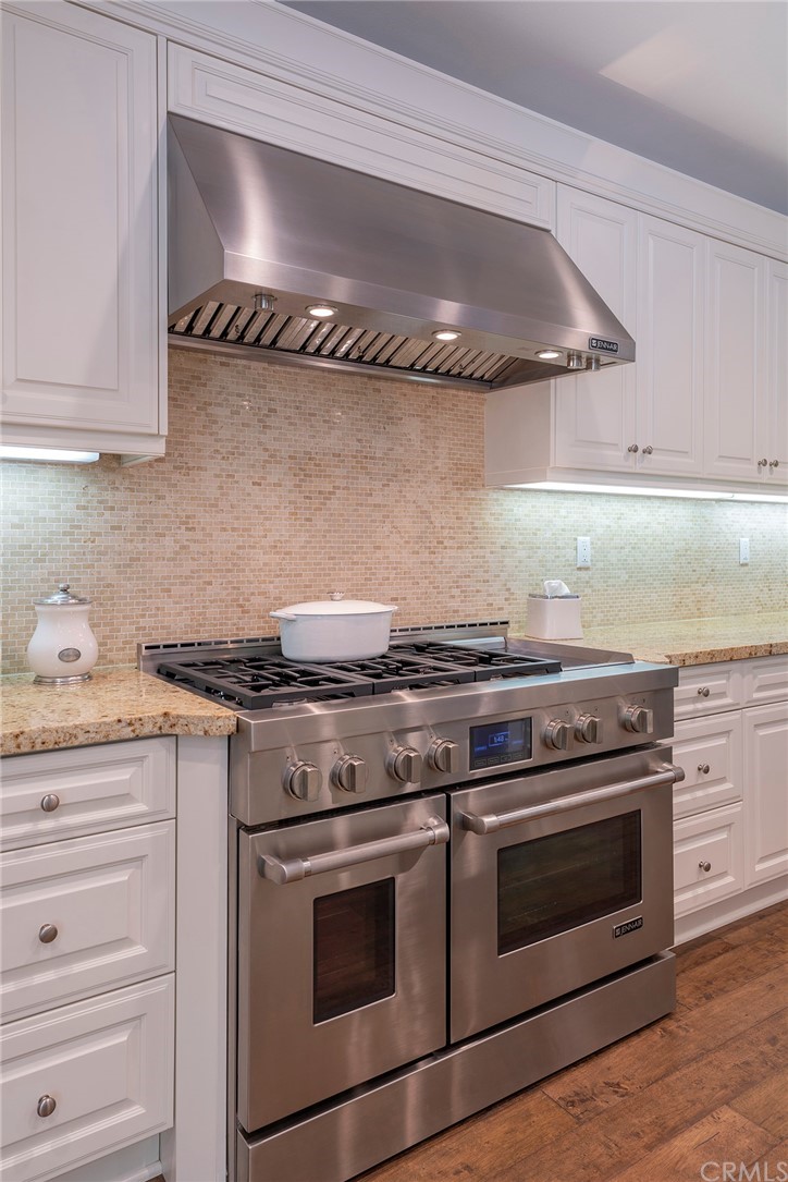 71 Como Irvine, CA 92618 - Photo 6 of 45 a stove top oven sitting inside of a kitchen