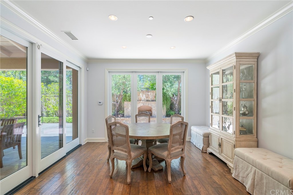 71 Como Irvine, CA 92618 - Photo 7 of 45 a view of a dining room with furniture window and wooden floor