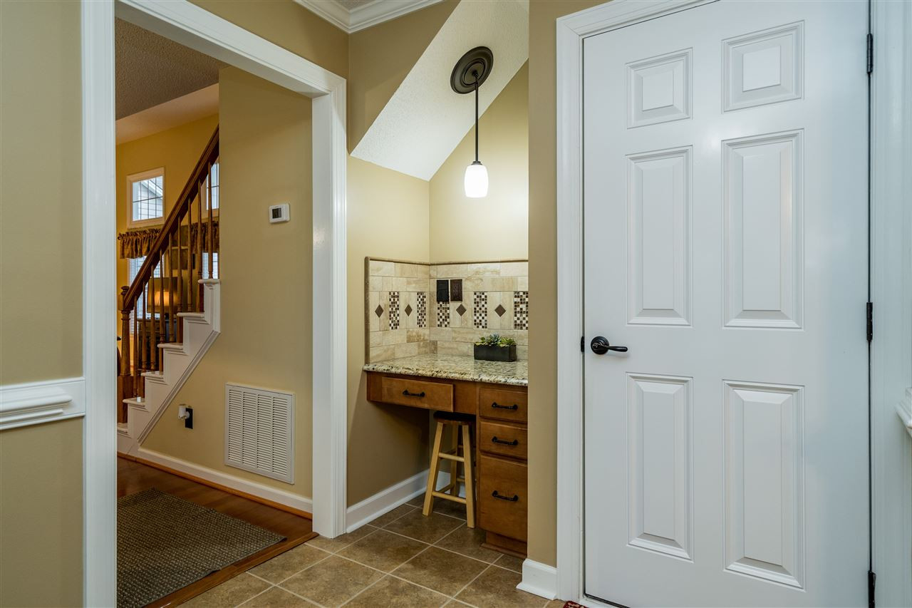 5213 Denmead Way Raleigh, NC 27613 - Photo 14 of 25 a view of a hallway with elevator and entryway