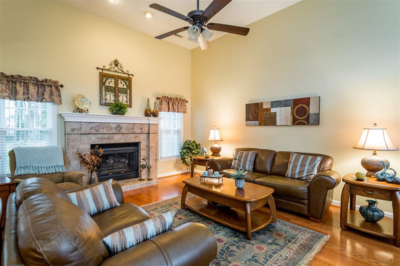 5213 Denmead Way Raleigh, NC 27613 - Photo 5 of 25 a living room with furniture and a fireplace