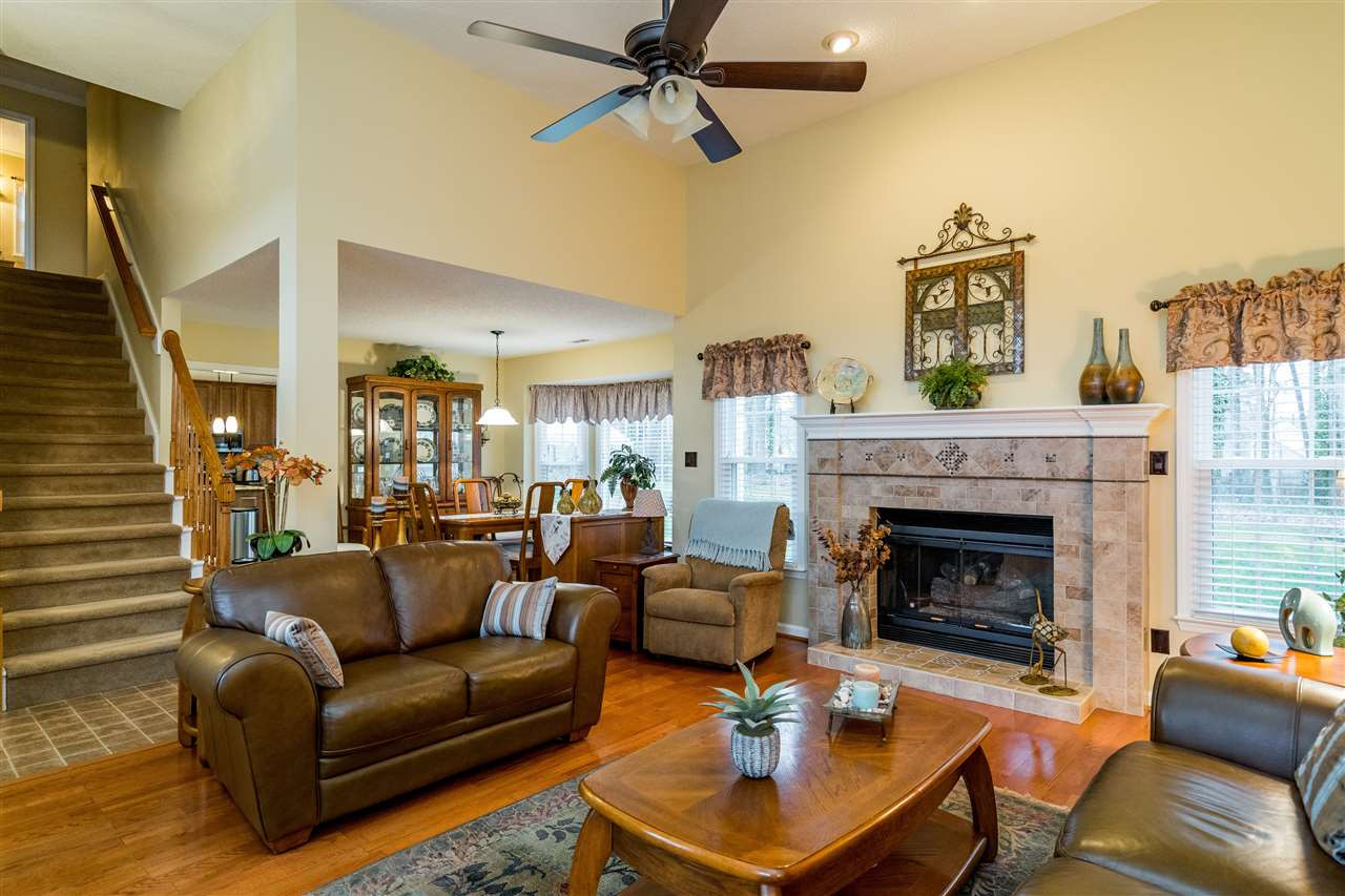 5213 Denmead Way Raleigh, NC 27613 - Photo 6 of 25 a living room with furniture and a fireplace