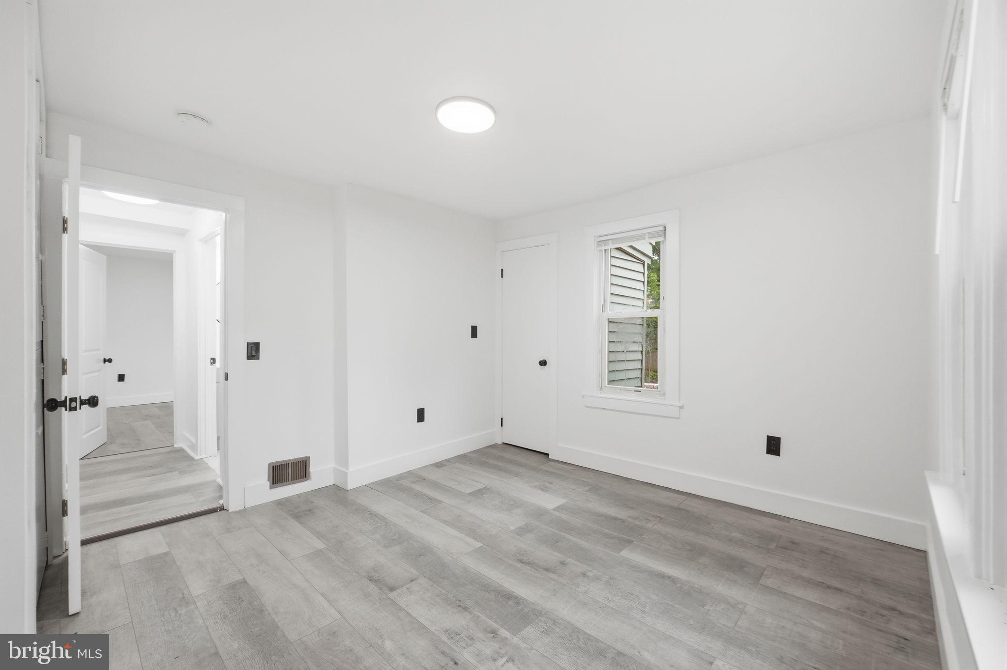 5906 Berwyn Road College Park, MD 20740 - Photo 26 of 46 wooden floor in an empty room
