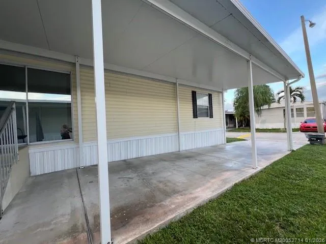 a view of a balcony with wooden floor