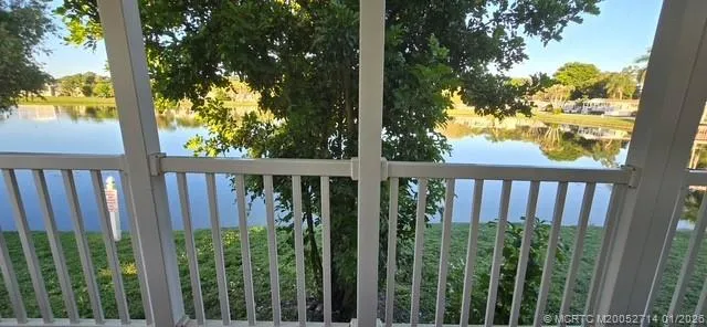 a kitchen with stainless steel appliances granite countertop a refrigerator and a stove