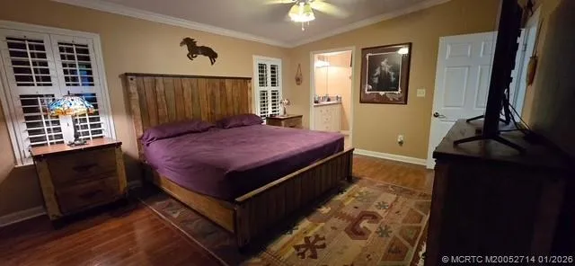 a view of an empty room with a window and fireplace
