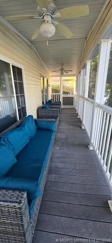 a view of room with wooden floor