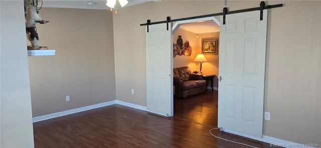 a kitchen with granite countertop white cabinets and sink