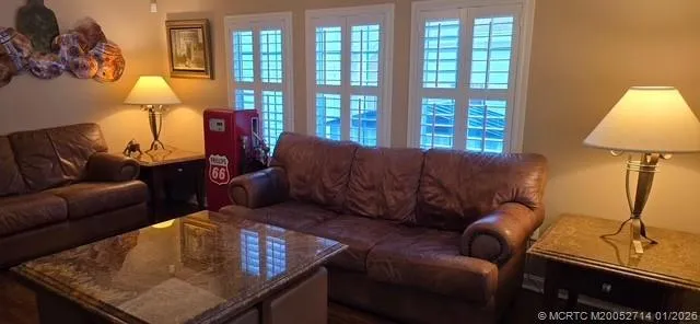 a kitchen with stainless steel appliances granite countertop a refrigerator sink and stove