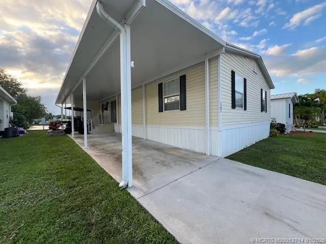 a view of a yard from a corridor
