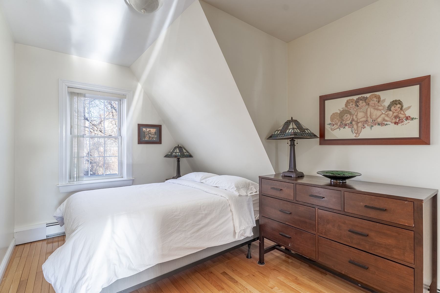 68-23 Exeter Street, Unit 2 Queens, NY 11375 - Photo 11 of 15 a bedroom with a bed and window