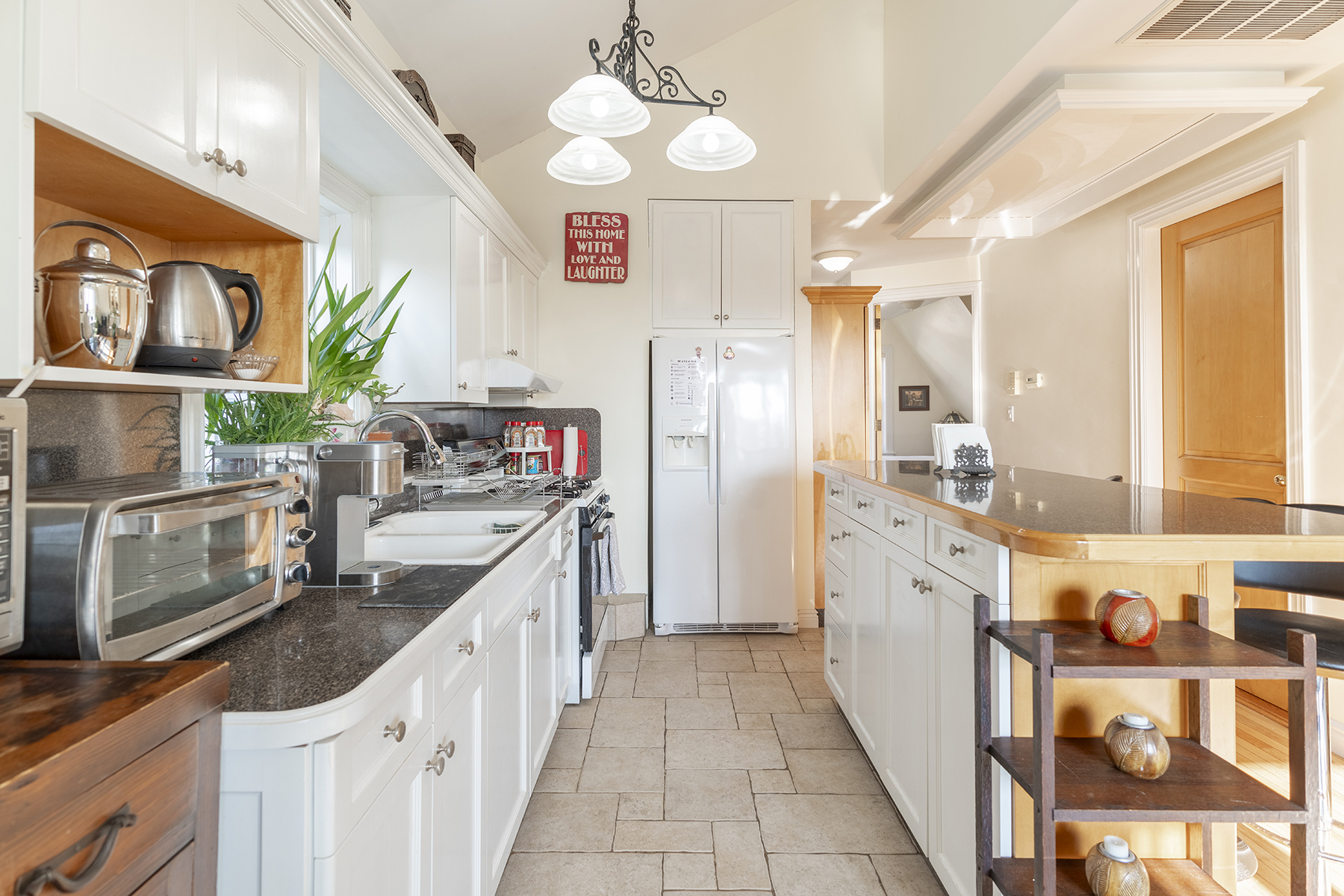 68-23 Exeter Street, Unit 2 Queens, NY 11375 - Photo 3 of 15 a kitchen with stainless steel appliances granite countertop a sink and refrigerator