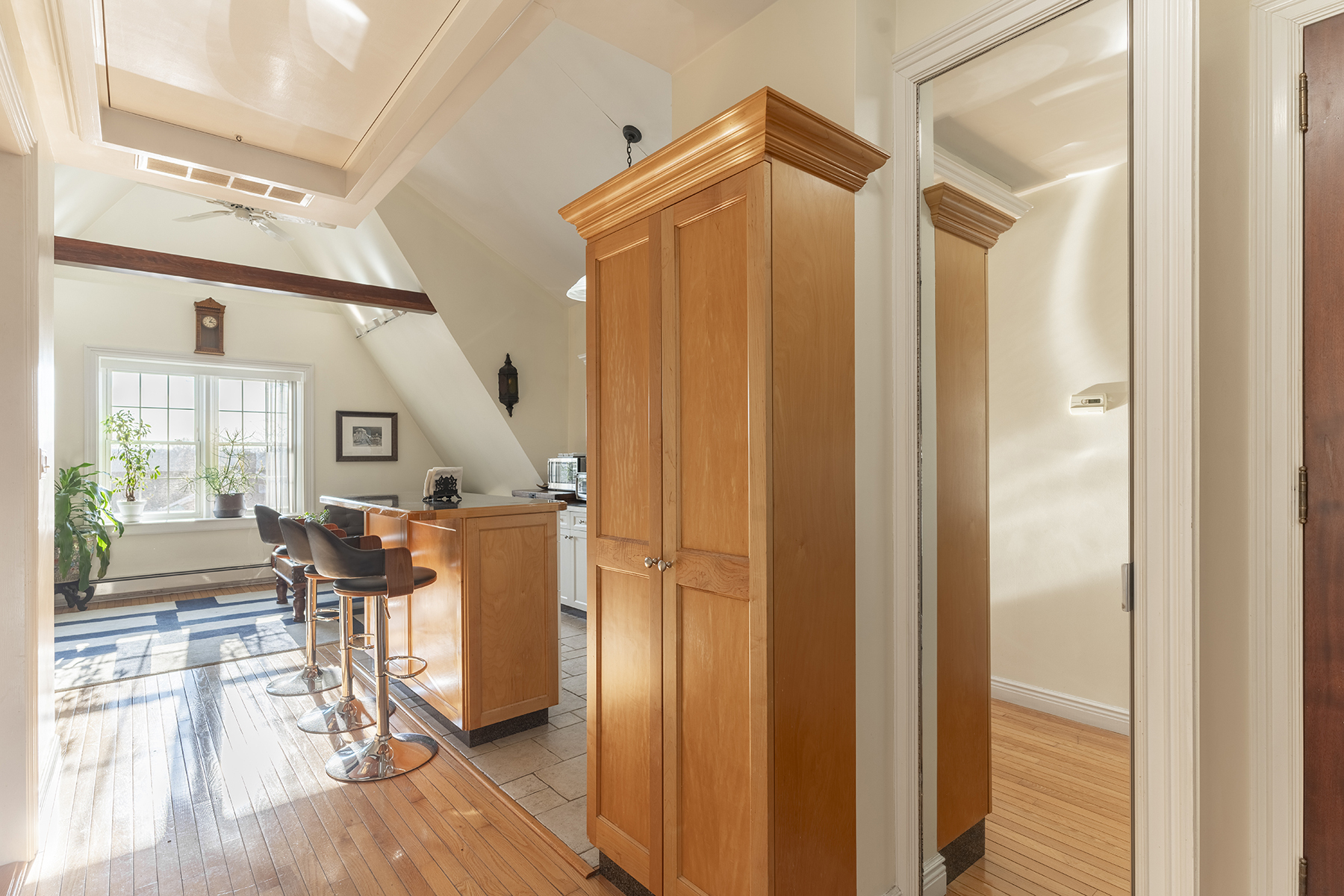 68-23 Exeter Street, Unit 2 Queens, NY 11375 - Photo 6 of 15 a view of a hallway with furniture and wooden floor