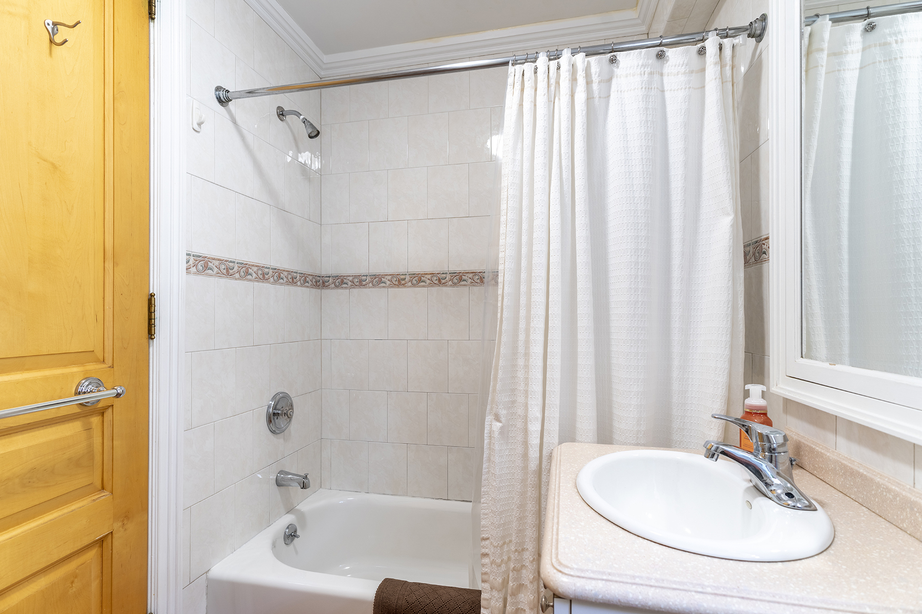 68-23 Exeter Street, Unit 2 Queens, NY 11375 - Photo 8 of 15 a bathroom with a sink and a mirror