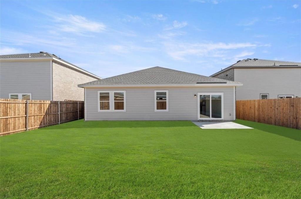 10308 Holy Cross Lane Crowley, TX 76036 - Photo 25 of 27 a backyard of a house with wooden floor table and chairs