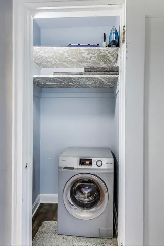 a utility room with washer and dryer