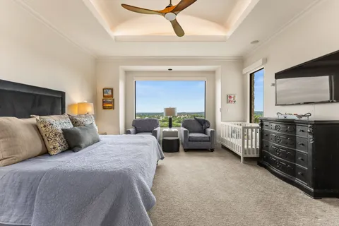 a bedroom with a bed and a couch