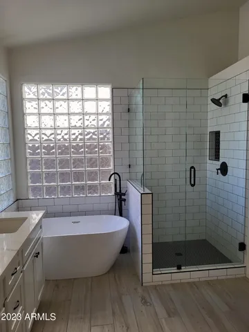 a bathroom with a bathtub and shower