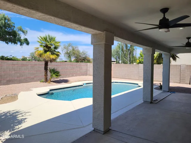 a view of a swimming pool and outdoor space