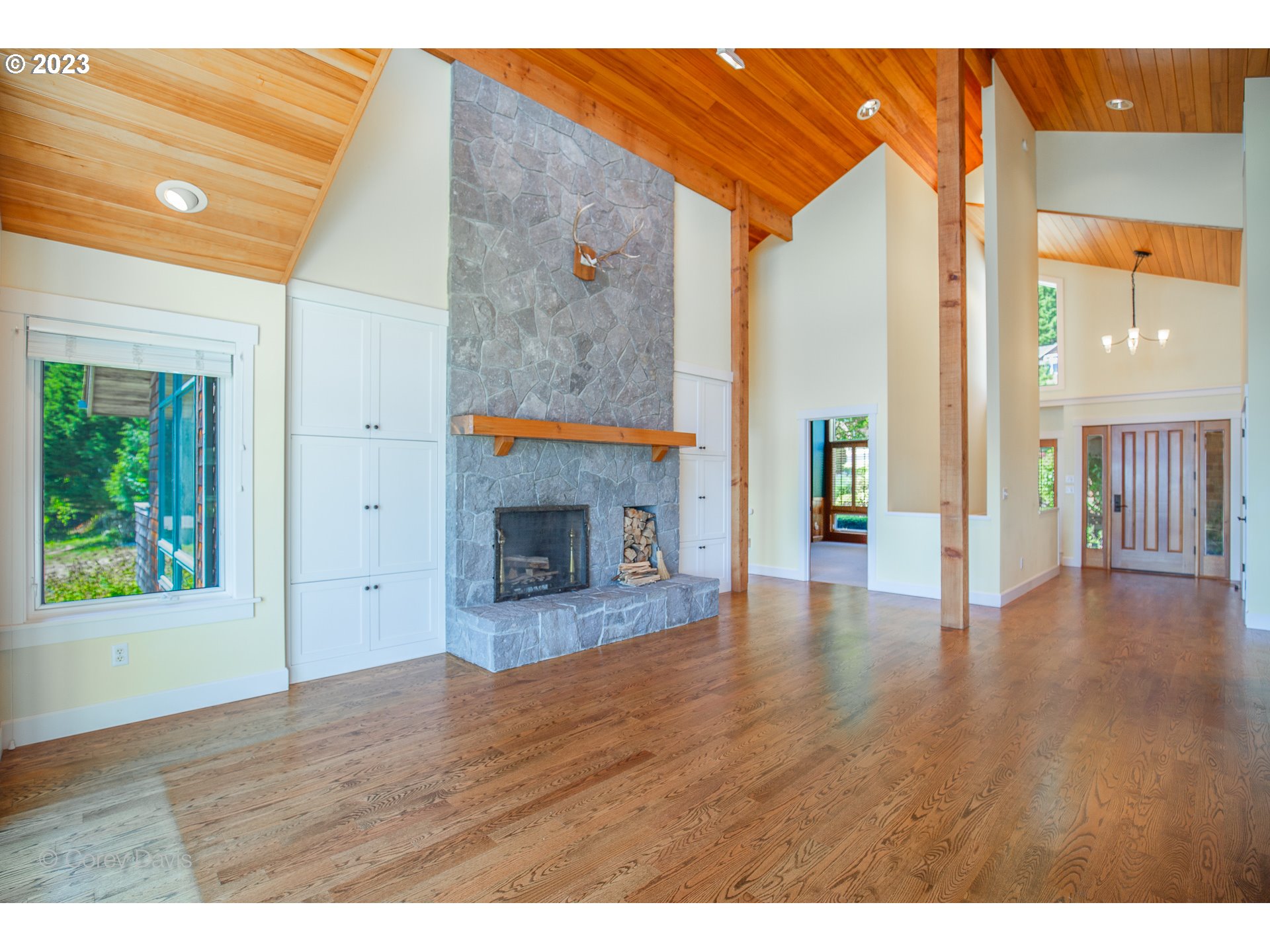 38680 Meadow Loop Nehalem, OR 97131 - Photo 11 of 44 a view interior of the house with wooden floor fireplace and windows