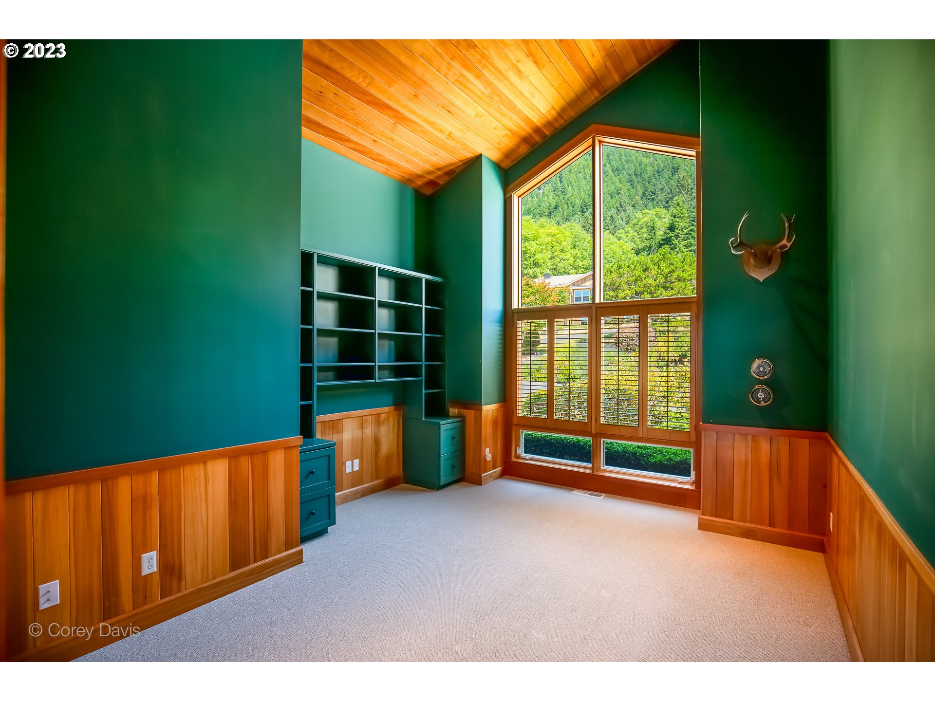 38680 Meadow Loop Nehalem, OR 97131 - Photo 27 of 44 a view of an empty room with wooden floor and windows