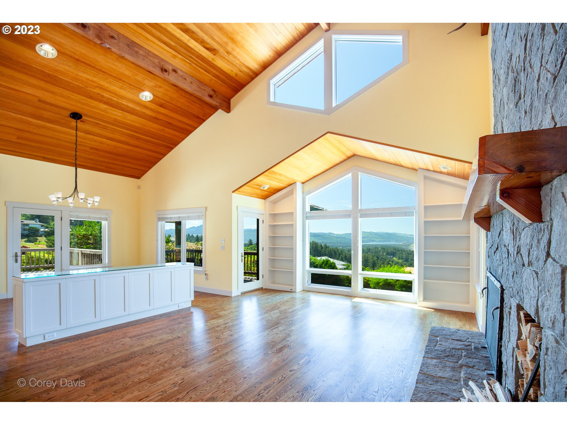38680 Meadow Loop Nehalem, OR 97131 - Photo 8 of 44 a view of an empty room with wooden floor and a window