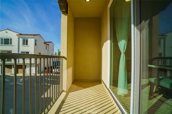 a view of a balcony with wooden floor