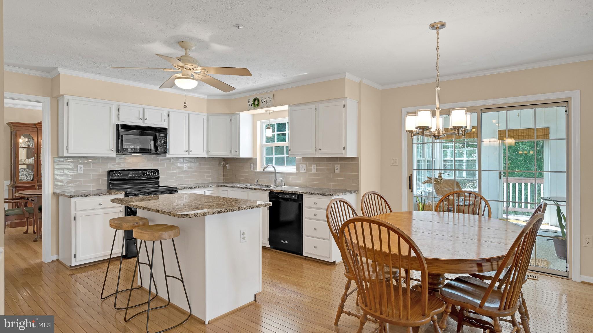 549 Small Reward Road Huntingtown, MD 20639 - Photo 4 of 33 Kitchen island with informal eat-in area