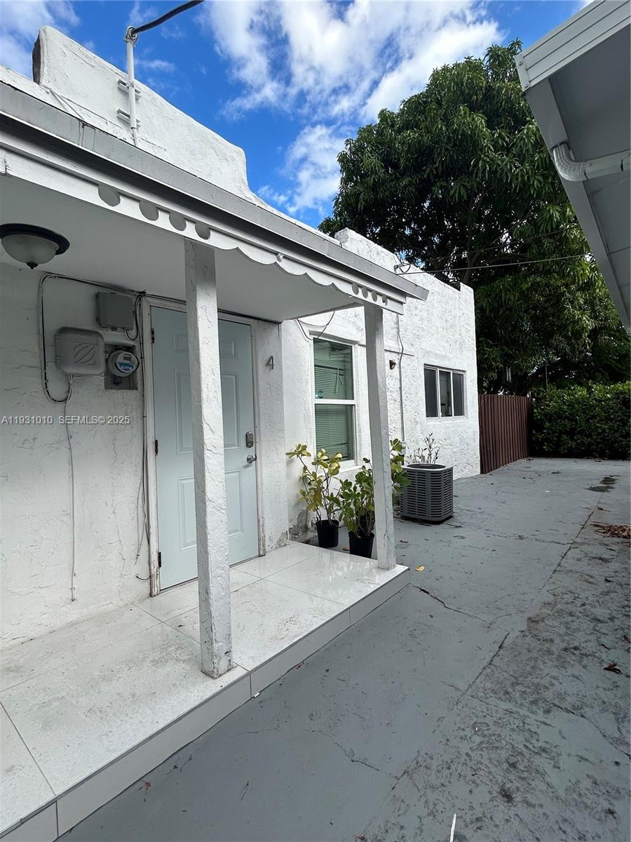 551 Northwest 41st Street, Unit 4 Miami, FL 33127 - Photo 1 of 13 a view of a house with a outdoor space