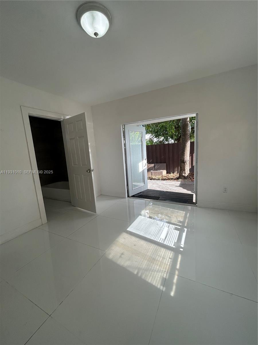 551 Northwest 41st Street, Unit 4 Miami, FL 33127 - Photo 11 of 13 a view of entryway with stairs