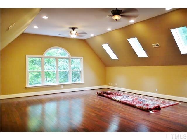 11320 Honeycutt Road, Unit LOT12 Raleigh, NC 27614 - Photo 4 of 25 3rd floor features Brazilian Cherry floors, a Palladian style window, & sky lights. (The 3rd floor was not permitted, but was completed by a general contractor.)