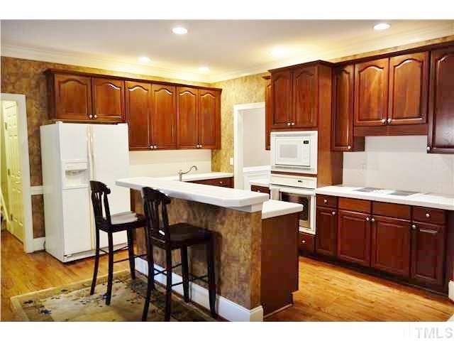 11320 Honeycutt Road, Unit LOT12 Raleigh, NC 27614 - Photo 7 of 25 Another kitchen view - recessed lights, built-in oven & microwave, & a large breakfast bar.