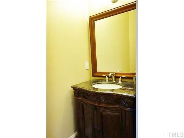 11320 Honeycutt Road, Unit LOT12 Raleigh, NC 27614 - Photo 10 of 25 A 1st floor powder room is convenient for guests with a gorgeous, decorative vanity & hardwood floors.