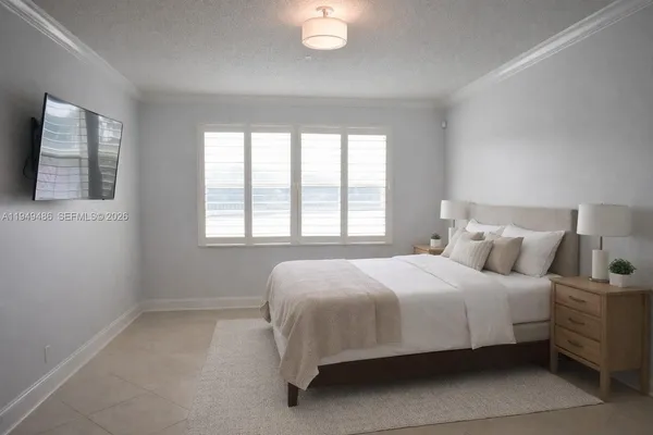 a bedroom with a bed and window