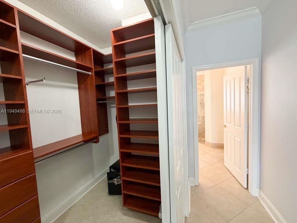 3279 Huntington Weston, FL 33332 - Photo 19 of 40 a view of walk in closet with empty racks