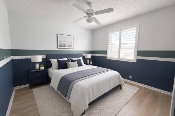 a bedroom with bed and window