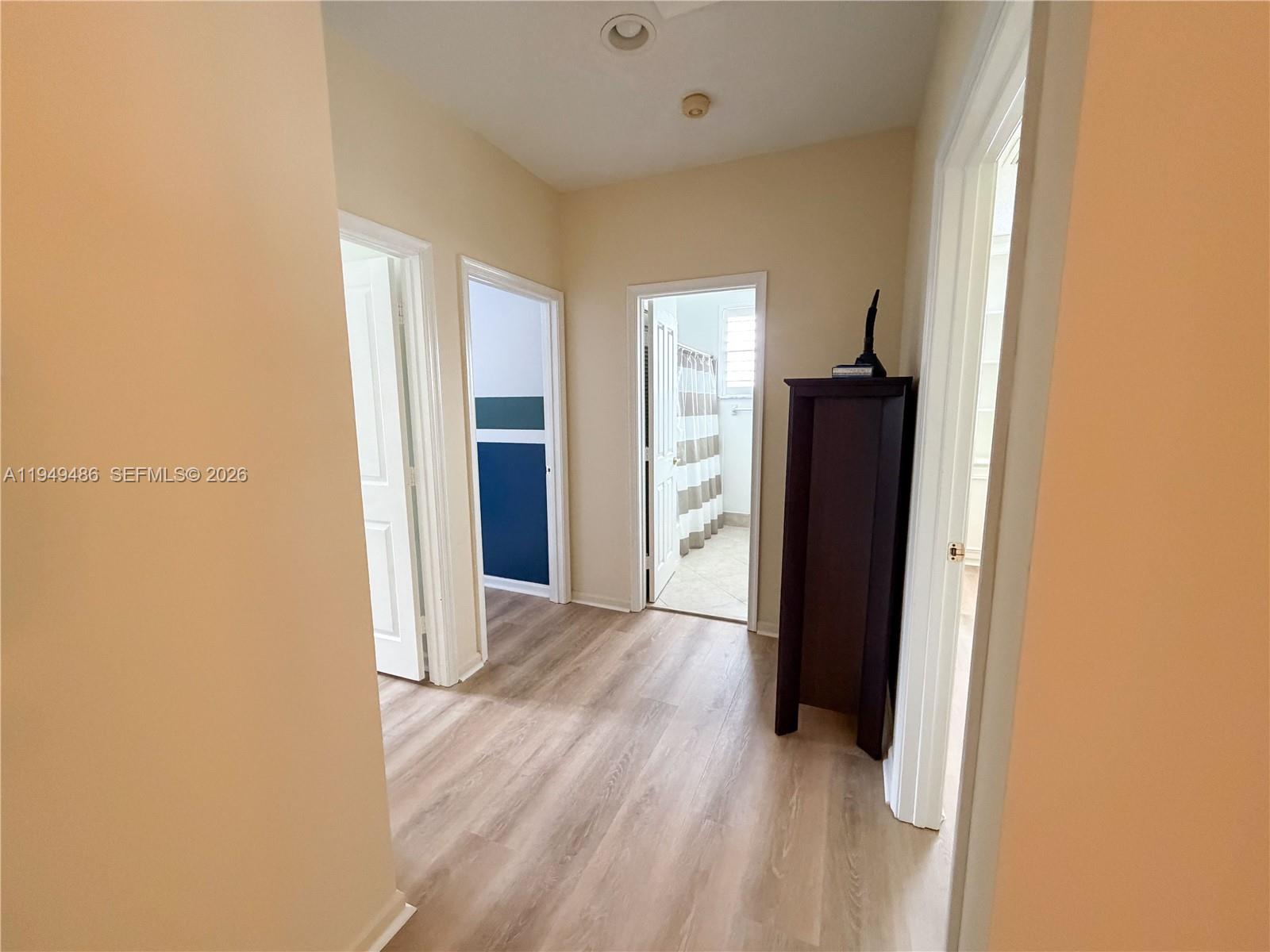 3279 Huntington Weston, FL 33332 - Photo 28 of 40 a view of a room with wooden floor and a refrigerator