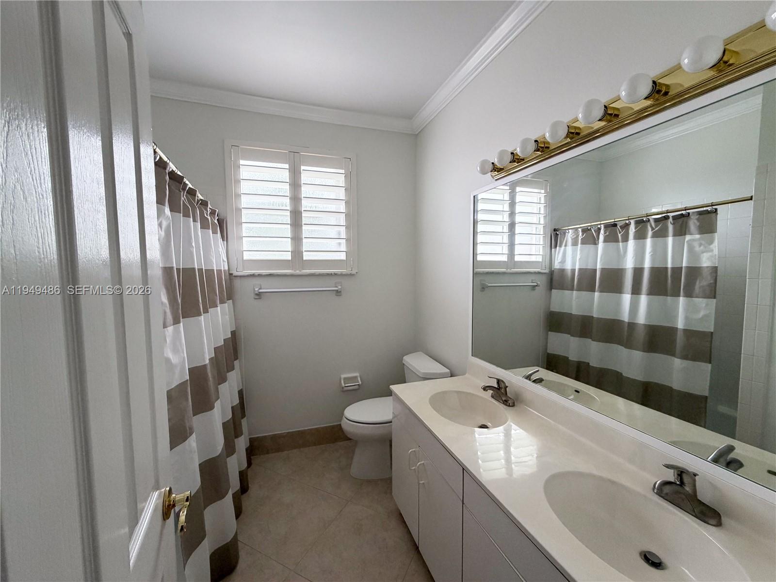 3279 Huntington Weston, FL 33332 - Photo 29 of 40 a bathroom with a sink toilet and shower