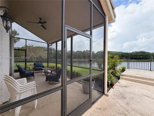 a view of a balcony with lake view and wooden floor