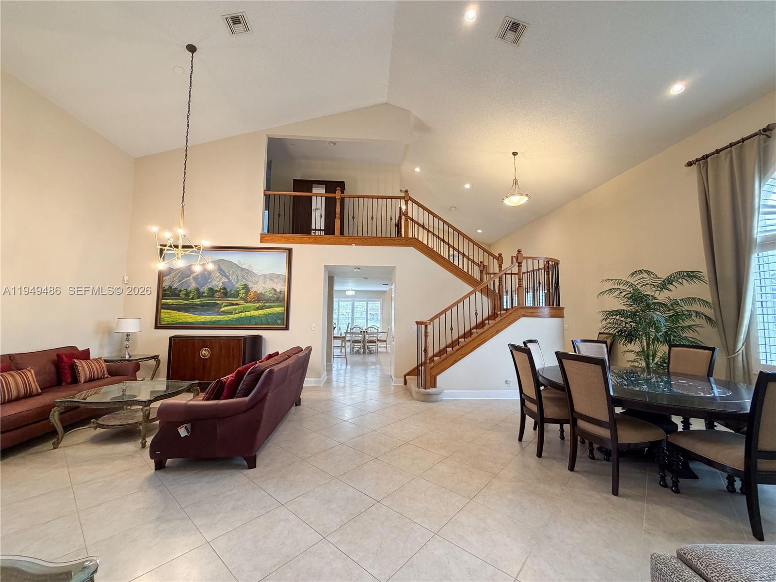 3279 Huntington Weston, FL 33332 - Photo 7 of 40 a living room with furniture and a flat screen tv