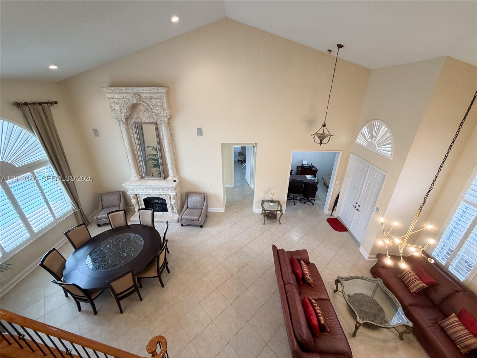 3279 Huntington Weston, FL 33332 - Photo 9 of 40 a living room with furniture and a flat screen tv