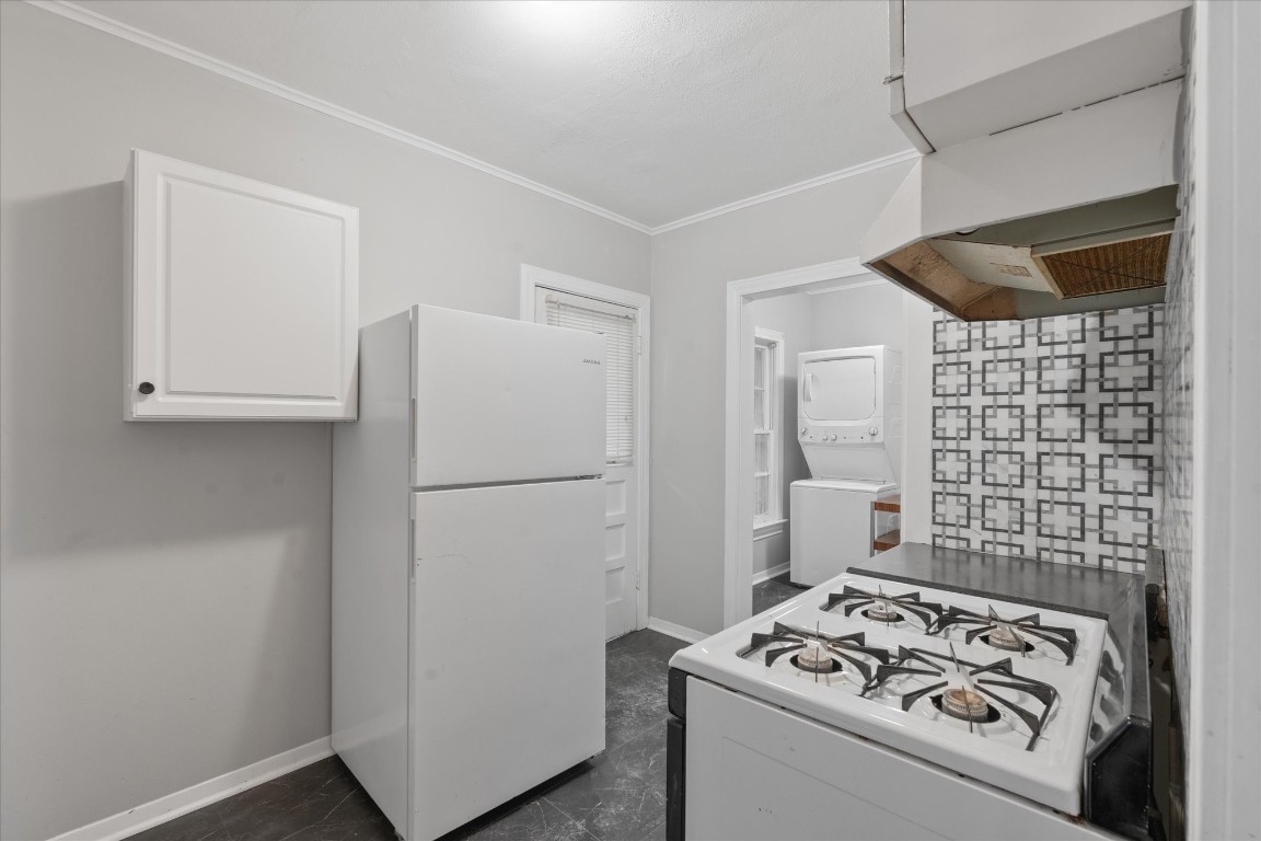 4337 Jefferson Street, Unit 1 Houston, TX 77023 - Photo 5 of 13 a white refrigerator freezer sitting inside of a kitchen