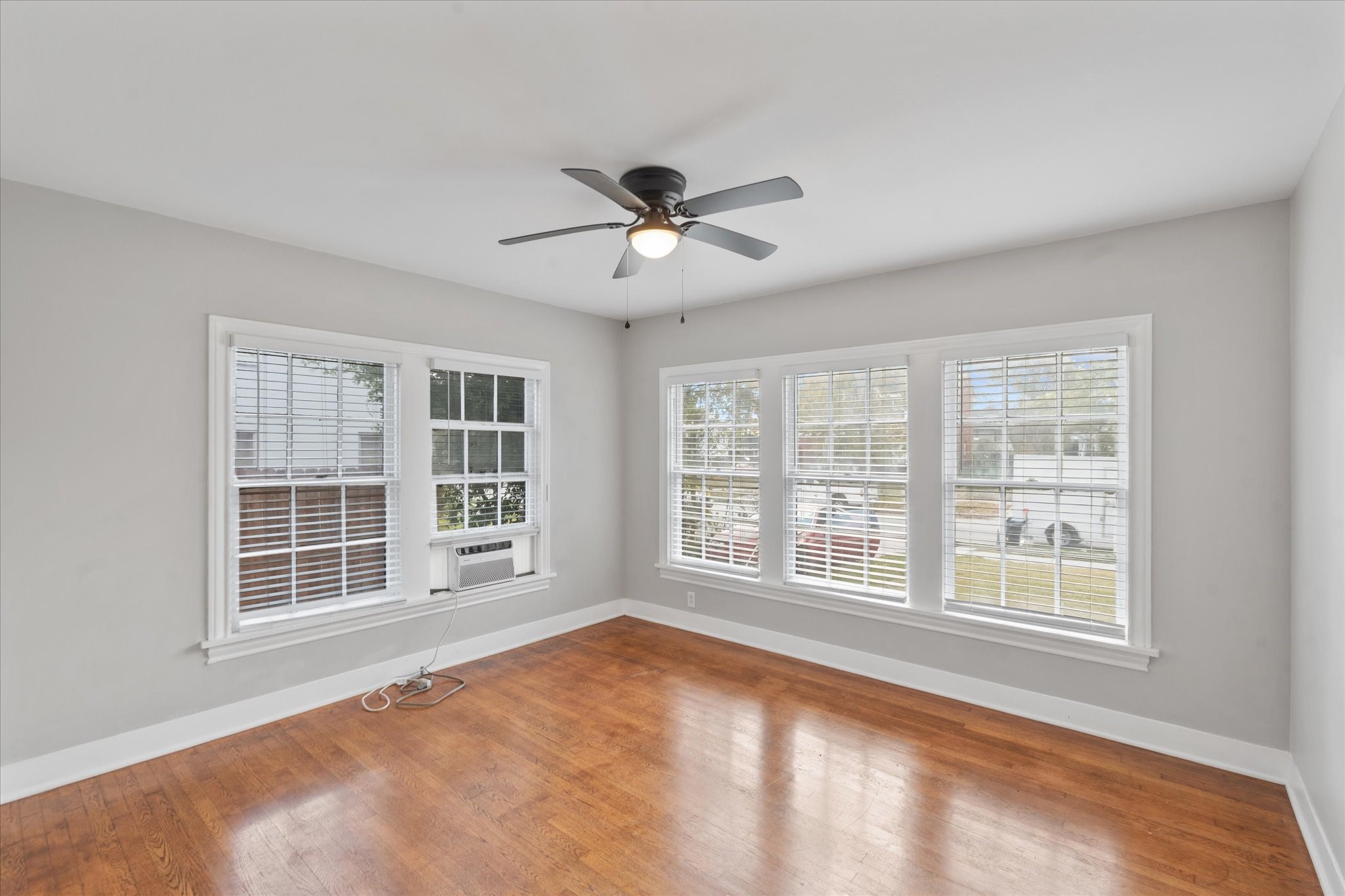 4337 Jefferson Street, Unit 1 Houston, TX 77023 - Photo 8 of 13 a view of an empty room with a window and ceiling fan