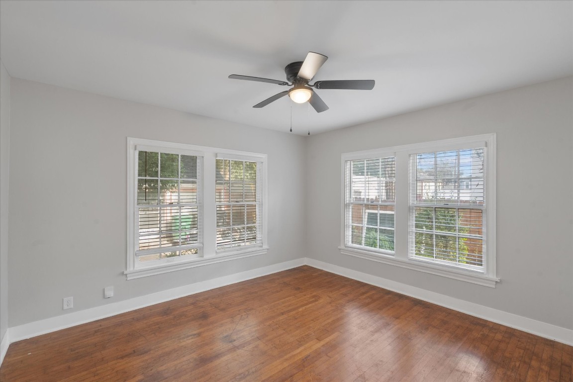 4337 Jefferson Street, Unit 1 Houston, TX 77023 - Photo 10 of 13 a view of an empty room with a window and wooden floor