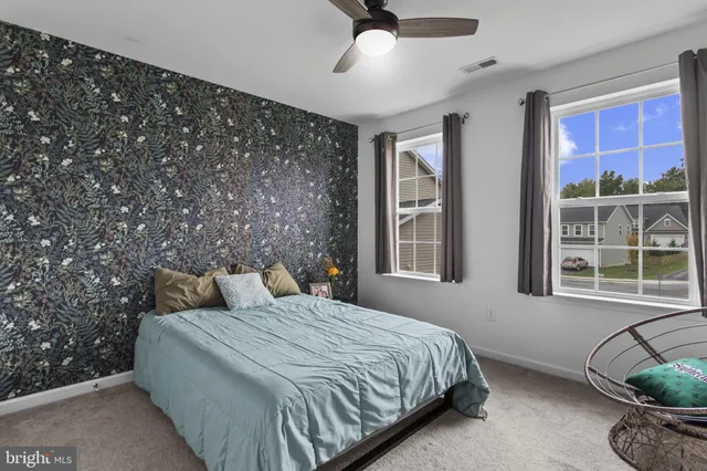 a bedroom with bed and window