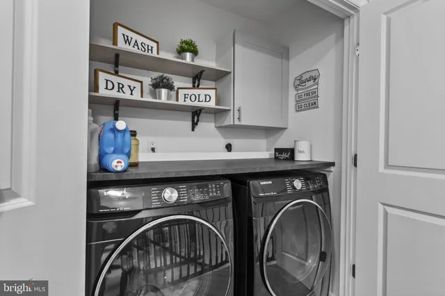 a view of washer and dryer in a utility room