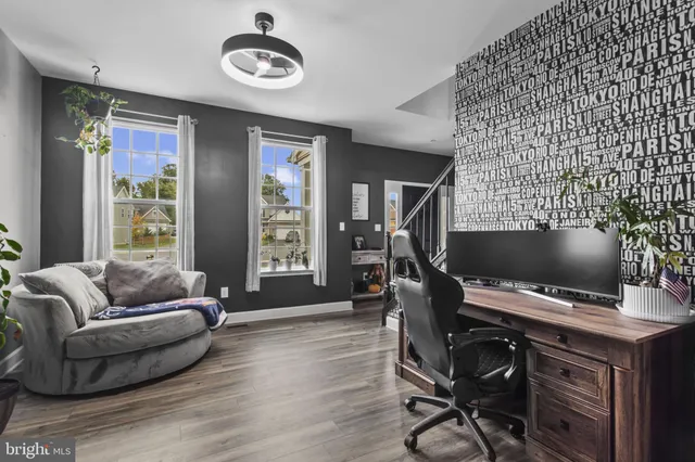 a workspace with furniture and window