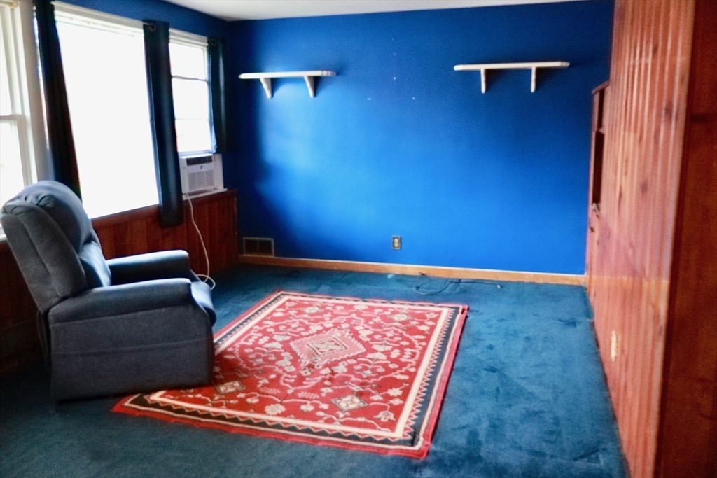 55 Blackstone Road Weymouth, MA 02191 - Photo 3 of 20 a living room with furniture rug and a window
