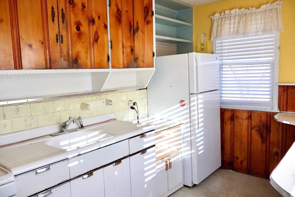 55 Blackstone Road Weymouth, MA 02191 - Photo 7 of 20 a bathroom with a sink and a mirror